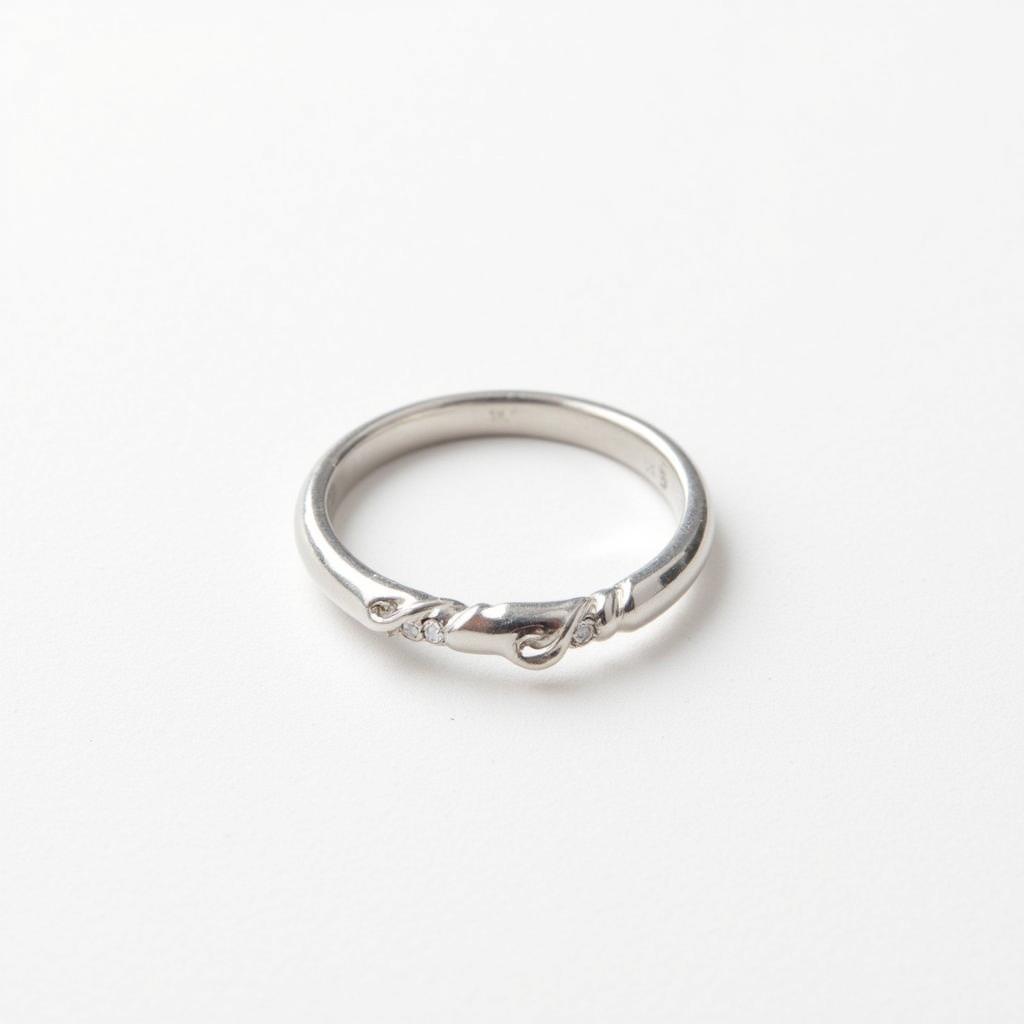 A close-up image of a white gold ring showcasing its bright, white surface.